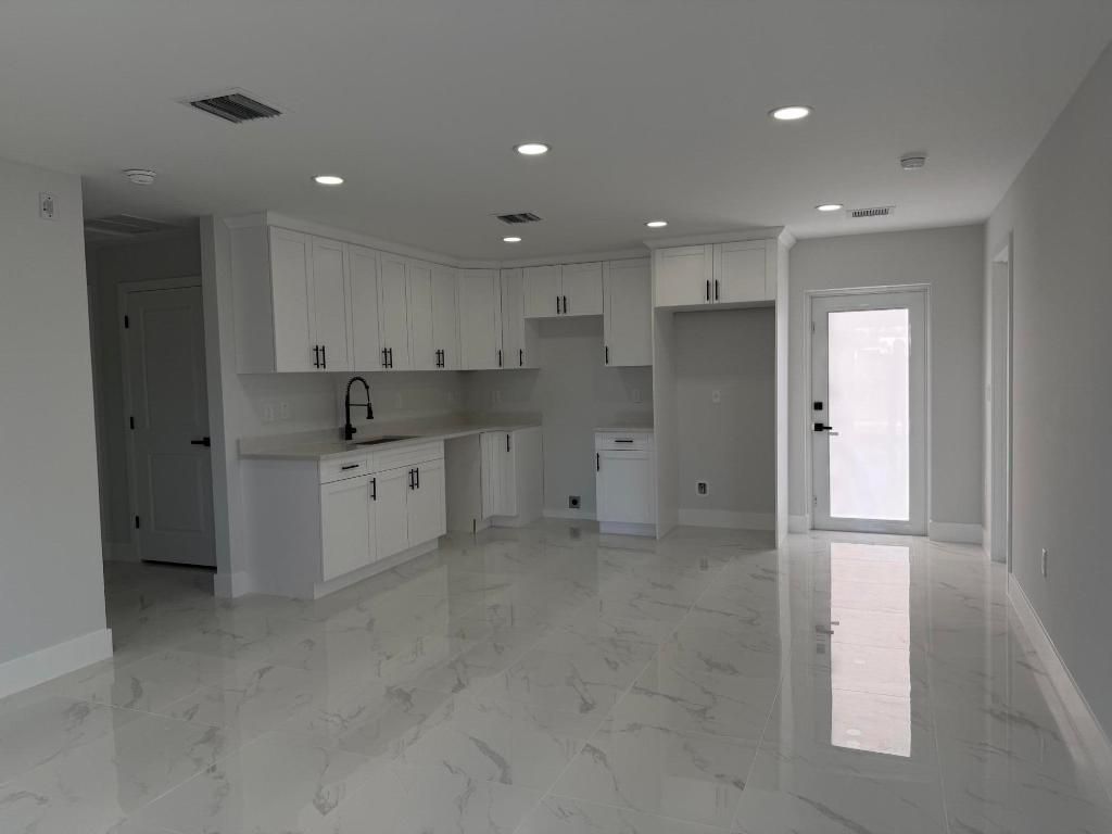 Photo of 1120 Ravenswood Street E, Lehigh Acres, FL 33974 (MLS # R11158185)