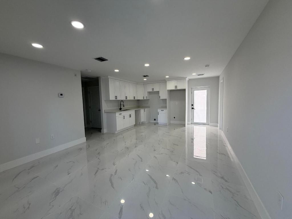 Photo of 1120 Ravenswood Street E, Lehigh Acres, FL 33974 (MLS # R11158185)