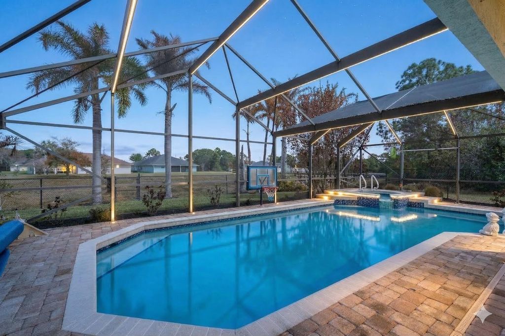 Photo of 5593 NW Wesley Road, Port Saint Lucie, FL 34986 (MLS # B26007340)