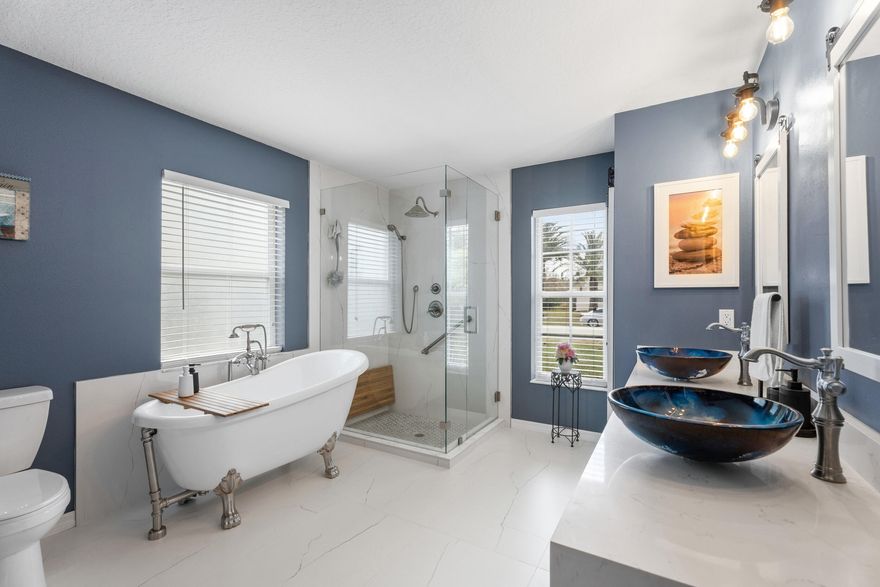 MASSIVE $15K PRICE IMPROVEMENT! This is an incredible opportunity to own one of the lowest-priced pool homes per square foot in the highly desirable Torino neighborhood. The big-ticket upgrades are already done for you. Enjoy ultimate peace of mind with a 2023 ROOF and COMPLETE HURRICANE PROTECTION. The UPGRADED KITCHEN boasts solid wood cabinetry, granite countertops, and a gas stove. Retreat to the LUXURY PRIMARY SUITE, completely renovated to feel like a high-end spa with a massive walk-in shower, gorgeous clawfoot tub, and dual vessel sinks. Step outside to your OUTDOOR OASIS featuring a heated pool and separate spa inside a fully screened lanai. The fully fenced, private backyard is surrounded by tropical landscaping overlooking a serene canal. Enjoy all of this with absolutely  NO HOA RESTRICTIONS. Come see the undeniable value waiting for you at 5593 Wesley Road!