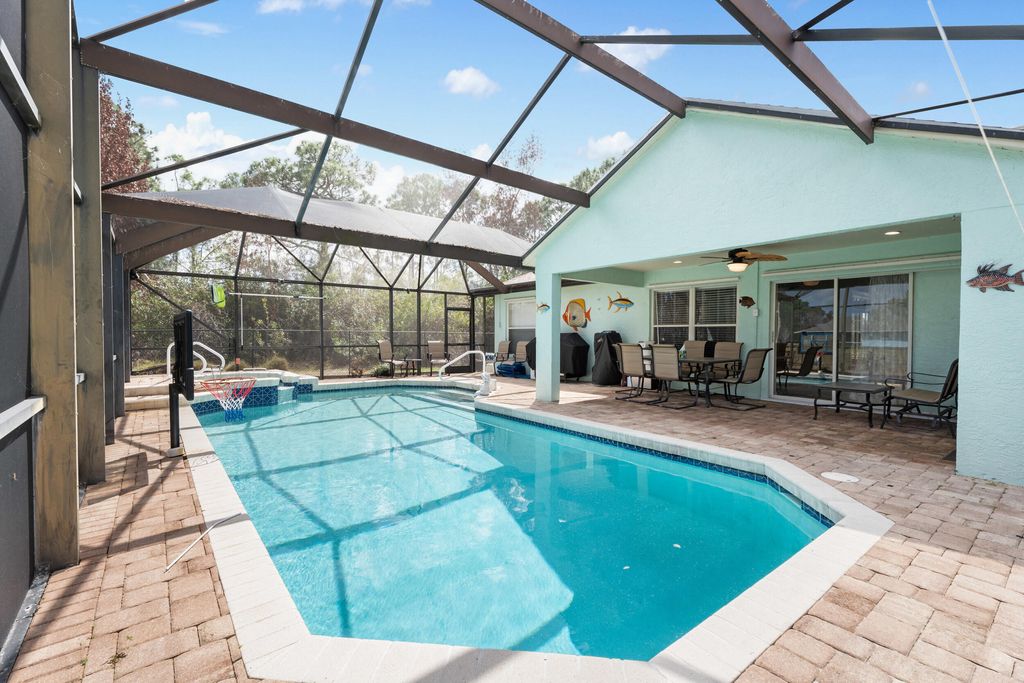 Photo of 5593 NW Wesley Road, Port Saint Lucie, FL 34986 (MLS # B26007340)