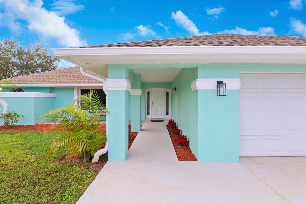 Photo of 2398 SW Lejune Street, Port Saint Lucie, FL 34953 (MLS # R10940376)
