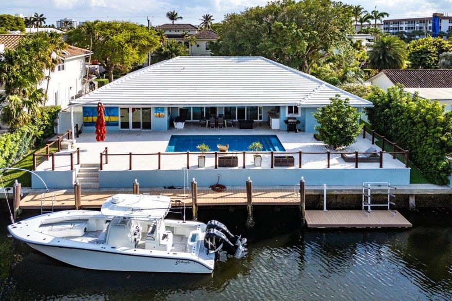 STUNNING RENOVATED 4BED/5BATH, 3 CAR GARAGE HOME WTH 90' OF WATERFRONT IN TROPIC ISLE! A BOATERS' PARADISE INCLUDING A 50' DOCK WITH WATER & ELECTRIC AND A FLOATING DOCK! ENJOY RELAXING BY THE HEATED, RESORT-STYLE SALTWATER POOL! LUXURIOUS PRIMARY SUITE WITH HIS/HER CLOSETS & HIS/HER BATHROOMS! HURRICANE IMPACT WINDOWS & DOORS! FULL HOUSE GENERATOR! GOURMET KITCHEN WITH A 6-BURNER GAS STOVE, 2 DISHWASHERS AND TOP-OF-THE-LINE APPLIANCES! EACH BEDROOM HAS ENSUITE BATHROOMS AND CUSTOM CLOSETS! THE GARAGE IS AIR CONDITIONED! FABULOUS HOME FOR INDOOR AND OUTDOOR ENTERTAINING! LIVE THE SOUTH FLORIDA LIFESTYLE IN PURE LUXURY!