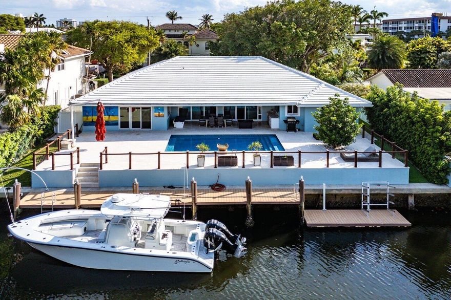 STUNNING RENOVATED 4BED/5BATH, 3 CAR GARAGE HOME WTH 90' OF WATERFRONT IN TROPIC ISLE! A BOATERS' PARADISE INCLUDING A 50' DOCK WITH WATER & ELECTRIC AND A FLOATING DOCK! ENJOY RELAXING BY THE HEATED, RESORT-STYLE SALTWATER POOL! LUXURIOUS PRIMARY SUITE WITH HIS/HER CLOSETS & HIS/HER BATHROOMS! HURRICANE IMPACT WINDOWS & DOORS! FULL HOUSE GENERATOR! GOURMET KITCHEN WITH A 6-BURNER GAS STOVE, 2 DISHWASHERS AND TOP-OF-THE-LINE APPLIANCES! EACH BEDROOM HAS ENSUITE BATHROOMS AND CUSTOM CLOSETS! THE GARAGE IS AIR CONDITIONED! FABULOUS HOME FOR INDOOR AND OUTDOOR ENTERTAINING! LIVE THE SOUTH FLORIDA LIFESTYLE IN PURE LUXURY!