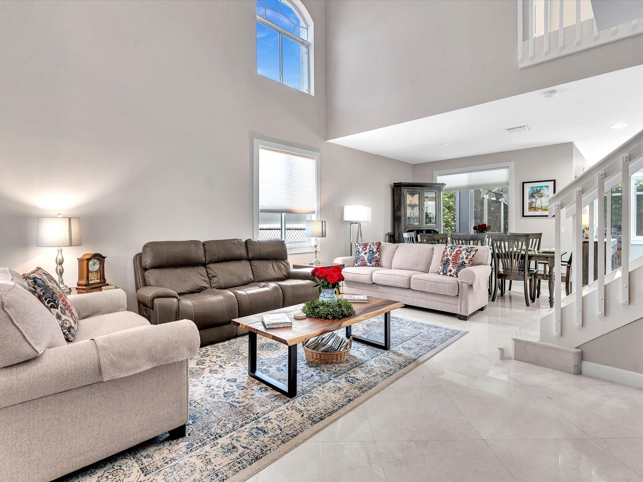 This exquisite 4 bedroom, 2.5 bathroom corner lot home is in the highly desirable Regency Lakes community. The screened lanai pool provides the perfect setting for relaxation and entertaining. A brand new roof and two car garage enhance the value of this property. Enjoy access to amenities such as tennis courts, pickleball, clubhouse, and pool with a low HOA. The open concept layout and upgrades make this home a standout choice for year-round enjoyment. With high ceilings and recessed lighting, the interior is bright and inviting. The oversized primary suite features a high ceiling and large walk-in closet, en suite bath with soaking tub. The upgraded kitchen is a chef's delight. This home is ideal for both indoor & outdoor entertaining, a must-see for buyers seeking a luxurious lifestyle.