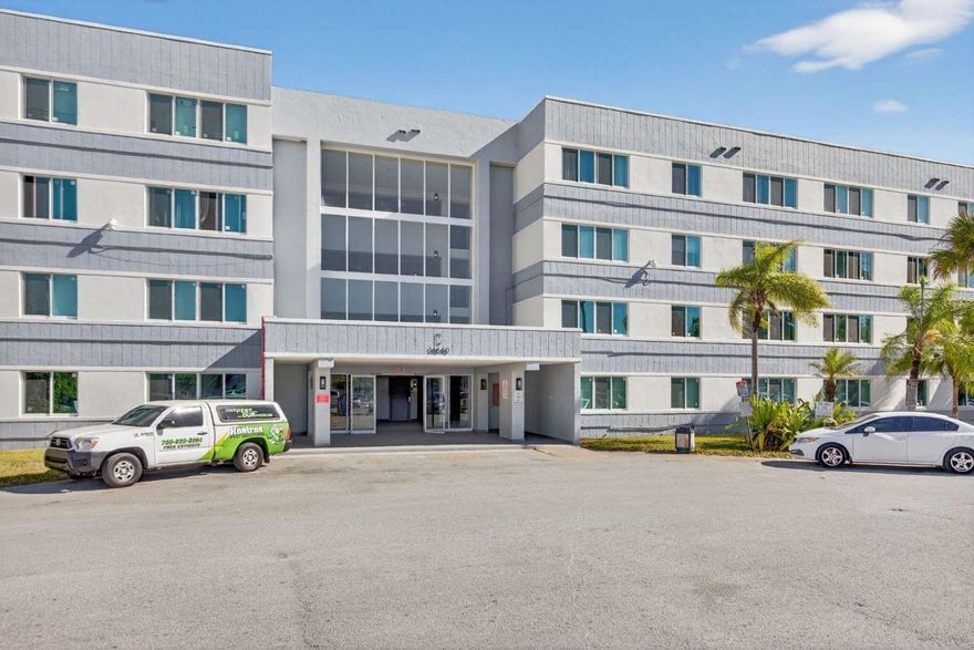 Beautifully updated unit featuring renovated bathrooms, new flooring, fresh paint, modern fixtures, and brand-new stainless steel appliances. Impact windows provide added safety and efficiency, and the HVAC system was replaced in 2024 for added peace of mind. The unit offers generous hallway closet space and convenient shared laundry at the end of the hall.Located in a gated community with security, the building has recently completed major capital improvements, including a new roof, hurricane-impact windows, exterior painting, and an enhanced entrance/lobby area. Water is included. One assigned parking space plus ample guest parking available.