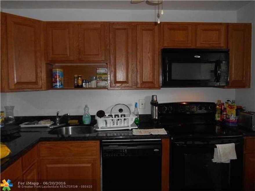 updated and conveniently located on first floor. neutral large tiles laid in diagonal pattern in living areas. newer kitchen and appliances . knockdown, clean unit. There is a $95 rec lease paid monthly on the pool in addition to the quarterly maintenance. UNIT occupied by great tenant; would like to stay. He is a disabled veteran and his mom. Pays $1250 a month. although there is a % restriction on rentals in complex, unit has a tenant grandfathered in. Easy to show.
