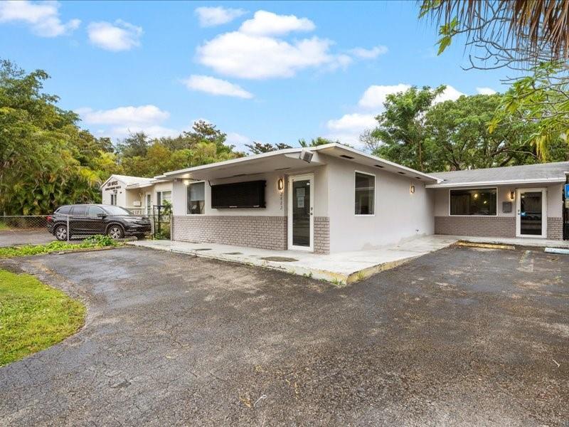 The subject property is a 2,241 square foot medical office building located in Coral Gables/Coconut Grove Florida. It is situated just off US 1, also known as Dixie Highway. It is situated on a 5,000 square foot lot or .1148 acres.
The building contains a large well-appointed waiting area, receptionist desk, computer/production area, Kitchen/breakroom, five exam rooms, one conference room, two private Doctor’s offices, Xray room, Employee restroom, patient restroom, three entrance and exit.
The office is tastefully decorated with laminate wood flooring, tile, fresh paint, decorative moldings, recessed LED lights and modern artwork. The property was formerly a dental office and is now used by Spine and Bone specialists.