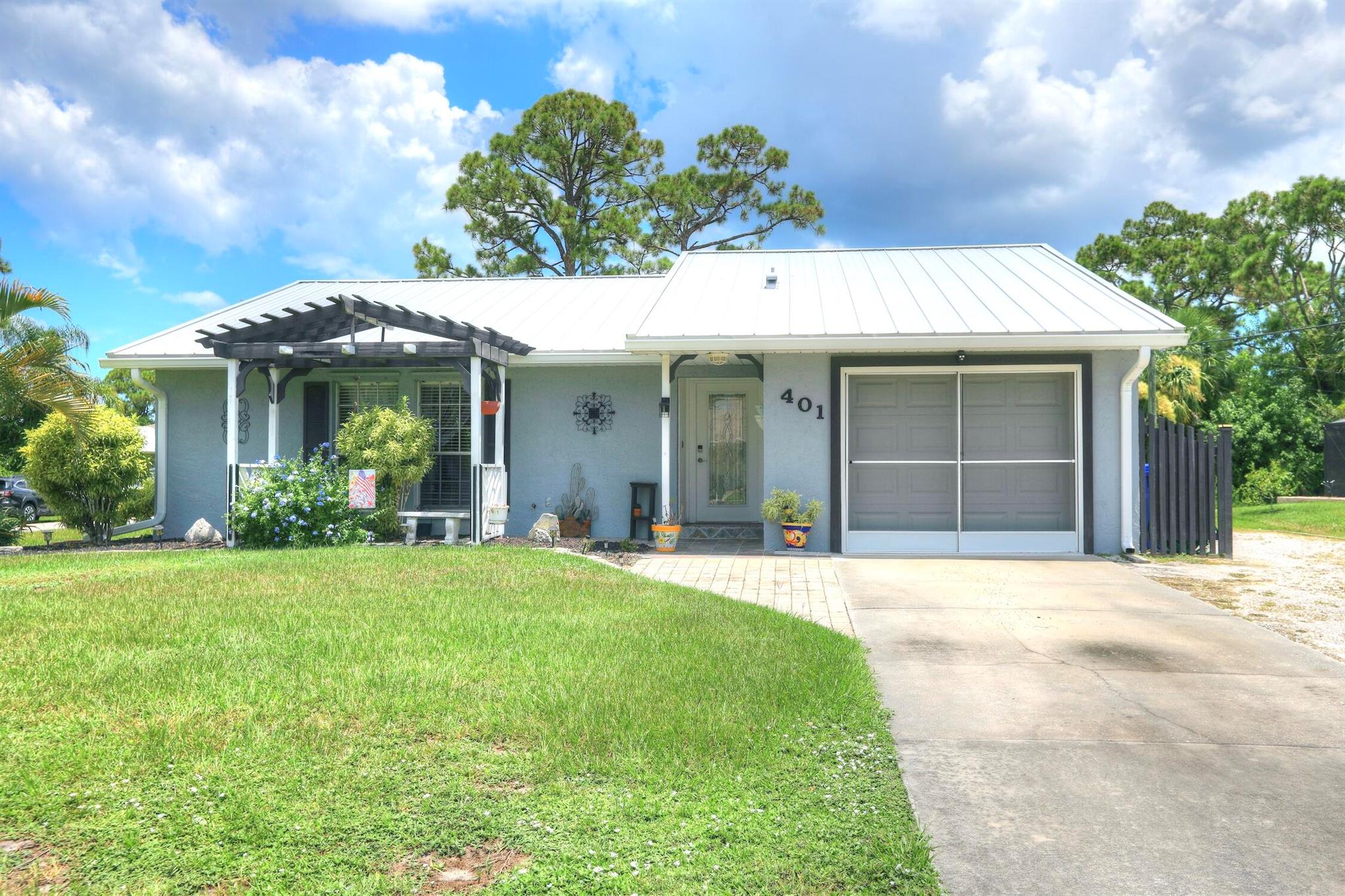 This charming 3 bedroom, 2 bath concrete block home on a corner lot boasts great curb appeal and tropical landscaping located in the heart of the Sebastian Highlands with no HOA! Home features a spacious 1 car garage, gally kitchen, large screened porch, extended outdoor paver patio leading to a large workshop that could easily be converted to additional living space. Plenty of room for RV/boat parking. Close to river, beaches and the best Sebastian has to offer!
