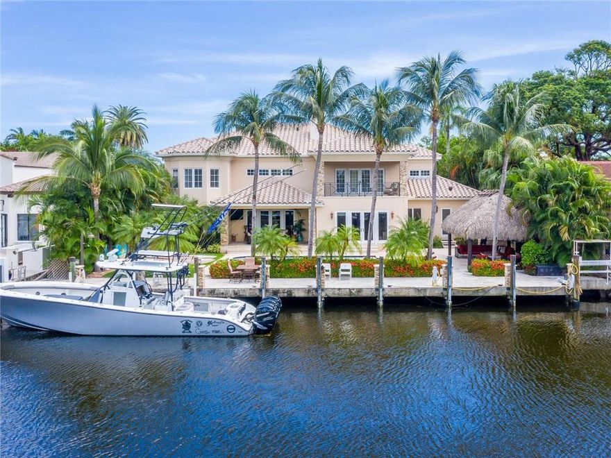 As you enter 711 Riviera you will be instantaneously impressed by the grand staircase, soaring ceilings and stunning chandelier.  This beautiful estate home provides a well designed floor plan and many artful design features.  The giant chefs kitchen with Viking gas stove offers an island plus massive bar area adjacent to the butlers pantry and open to the sumptuous family room with pool and water views.  The upstairs master has a spacious private balcony to view your boat along with 2 bathrooms and 2 walk in closets.  The exterior is where you will soak up the alfresco FL lifestyle.  It is perfect for the avid boater boasting a 100 ft concrete dock with water and power.  The spa like grounds include a massive tiki hut, summer kitchen, jacuzzi and more.  Walk to the beach and nightlife.