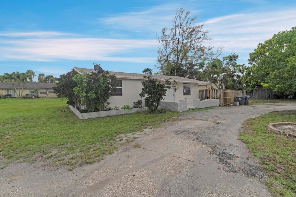 Photo of 3548 Melaleuca Lane, Lake Worth, FL 33461 (MLS # F10515985)