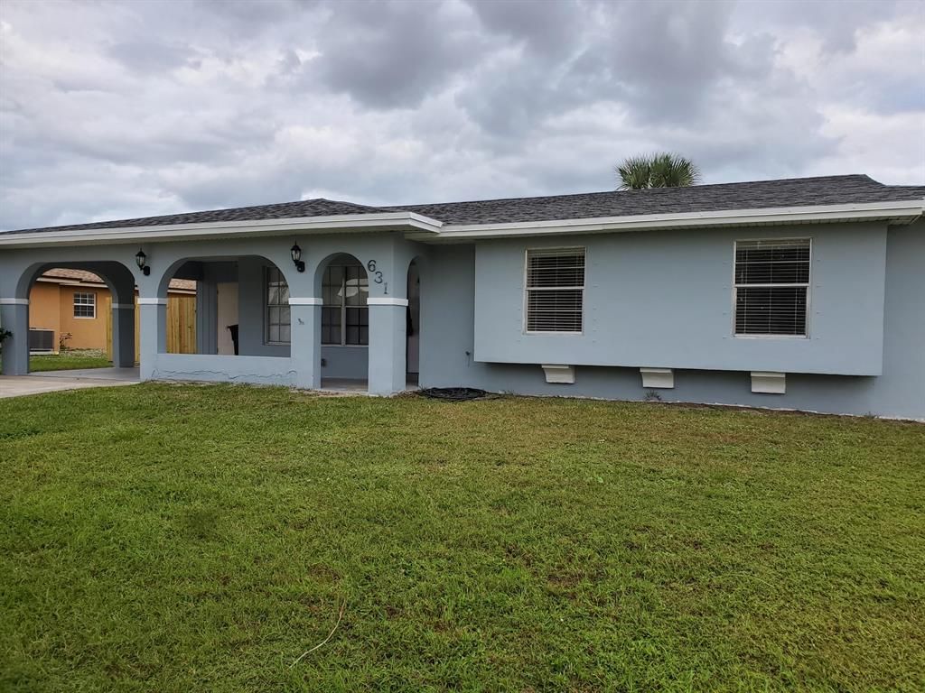 Photo of 631 SW Curry Street, Port Saint Lucie, FL 34983 (MLS # R10762231)