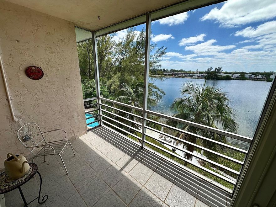 Really nice top floor 2/2 condo with direct views of large lake from every room! Screened patio overlooks both the lake and the community pool. This clean and well-kept home is move-in ready. The kitchen has refinished cabinets and quartz countertops, and good cabinet space. All rear windows are impact glass, front windows have shutters.  Convenient to I-95, the Turnpike, shopping, and only 3 miles from the beach. The building has two elevators and multiple laundry rooms with many washers and dryers. The assigned parking space (56) is close to the building, and there are plenty of guest spaces. Also there is a separate locking storage closet. This condo has much to offer!
