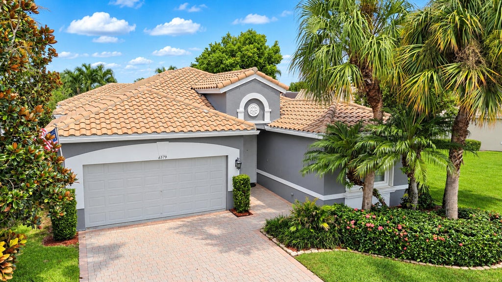 Photo of 6579 PAVONE Street, Lake Worth, FL 33467 (MLS # B26074137)