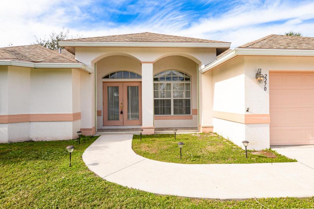 Photo of 2270 SW Tampico Street, Port Saint Lucie, FL 34953 (MLS # R10943555)