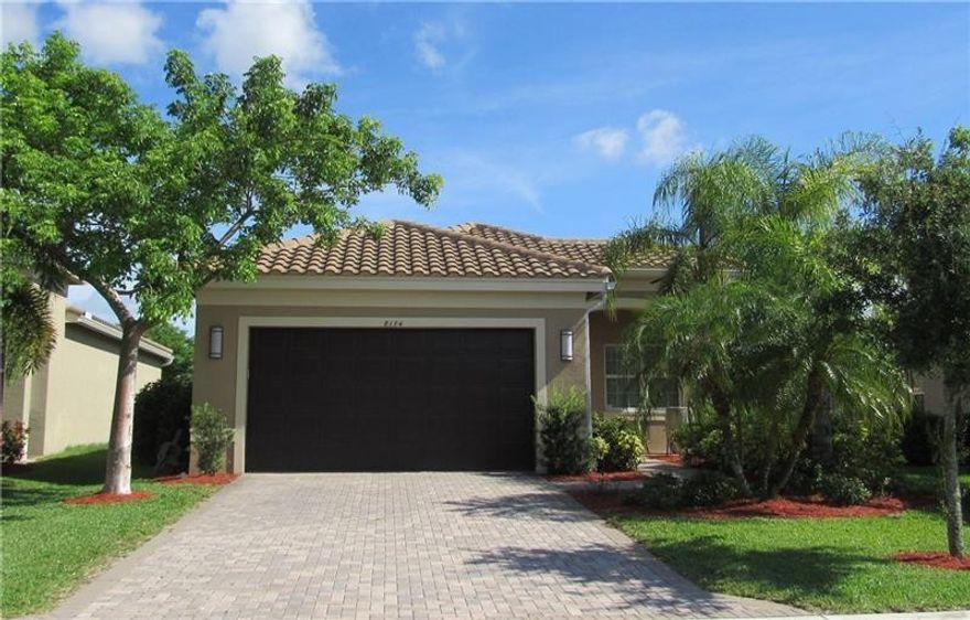 SPECTACULAR lakefront Tobago model in desirable Canyon Trails with BEAUTIFULLY landscaped clubhouse views. MUST SEE! One of a kind featuring $80k in upgrades. 24x24 polished porcelain tiles and crown molding throughout. Chefs kitchen with granite countertops and upgraded appliances. Master with his/hers custom closets and blackout remote shade. Bathrooms feature marble countertops with counter to ceiling framed mirrors. Large living room with remote shade and open floor plan great for entertaining!