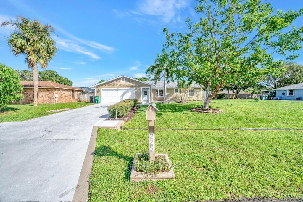 Photo of 225 SE Ray Avenue, Port Saint Lucie, FL 34983 (MLS # R11028447)