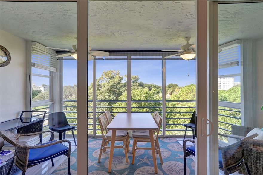 Welcome to 535 Oaks Drive penthouse in the sought-after Palm Aire Country Club. This unit features porcelain tile flooring and impact windows throughout. Completely remodeled with designer taste and top of the line finishes. Washer and dryer in unit, newer AC installed in 2022 and water heater in 2020. Gourmet kitchen with high quality stainless steel appliances.  Enjoy a golf course view from the fully glassed-in balcony. Unit comes furnished, turn key and cable TV plus internet are included in the HOA fee. Convenient, move-in ready living with timeless style and resort-style amenities.  Close to shopping, restaurant and the new Harrah's Casino in Pompano Beach.