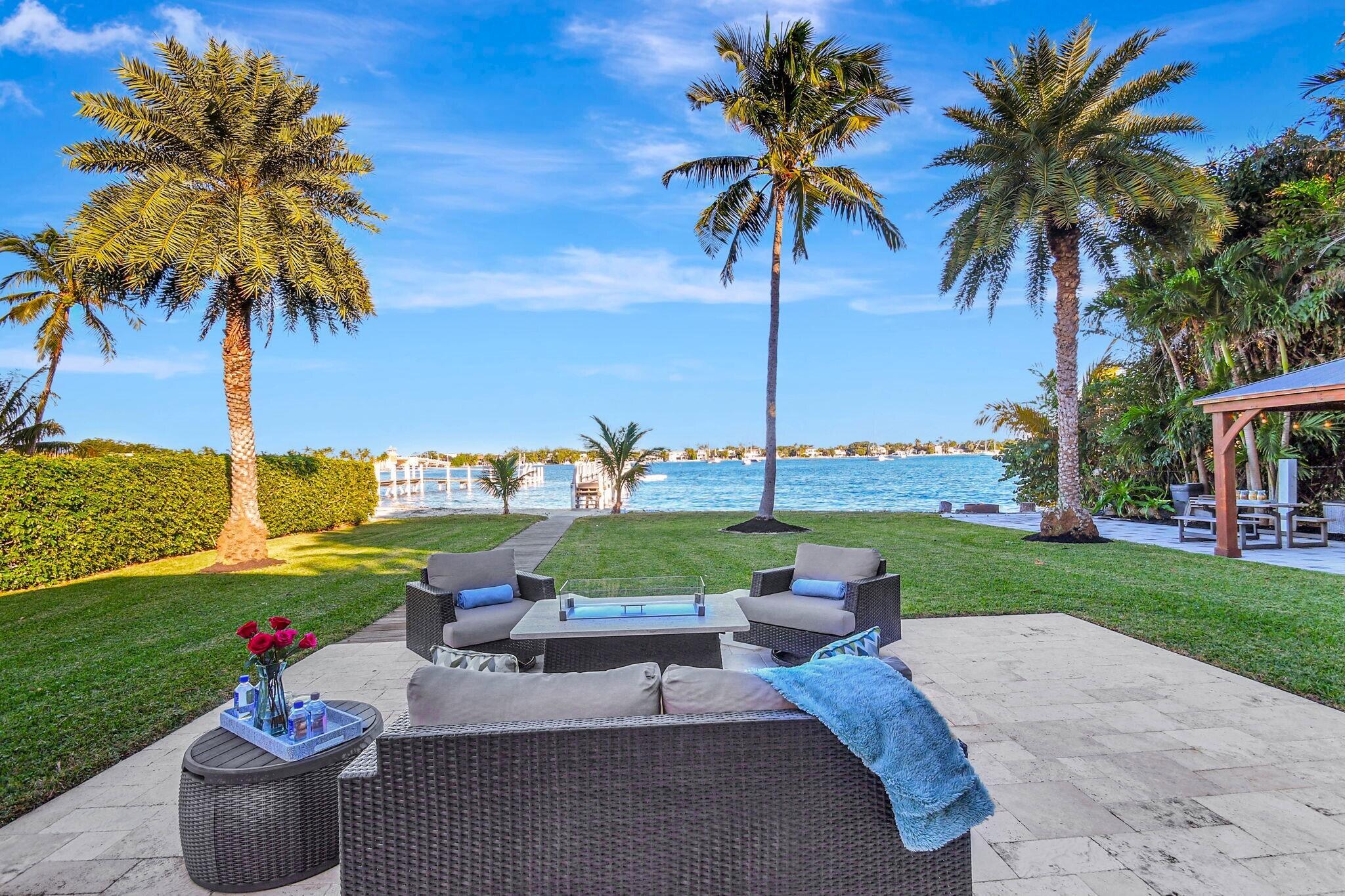 Welcome to your dream intracoastal getaway! This inviting home offers a primary bedroom with a Sleep Number mattress, an office/den with a convertible bed, and a separate guest house featuring a kitchenette/wine fridge that accommodates up to 4 guests. With floor-to-ceiling windows/doors along the east side, you'll be captivated by water views. Have a boat, jet skis, or an RV? Bring them along! This property boasts a private 85' beach, a 180' dock complete with electric/water, 2 floating docks for a pontoon boat & for jet skis/kayaks. Enjoy a refreshing outdoor shower, a charcoal BBQ ,picnic area, a cozy firepit, gazebo for al fresco dining & spacious open porch with comfy seating and a fire feature-perfect for unwinding. Everything you need is minutes away. 30 Day Minimum/Tenant Approval