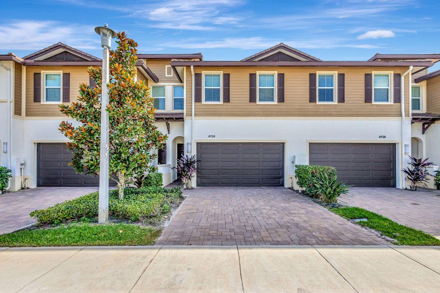 Ultra clean, newer townhome in the Pointe Midtown neighborhood. Freshly painted, new wood floors, impact glass, 2 car garage, walk to pool, shops & restaurants that are all in close proximity. Immediate occupancy. Great location just off PGA & Military. Close to 95, easy access to downtown & airport.