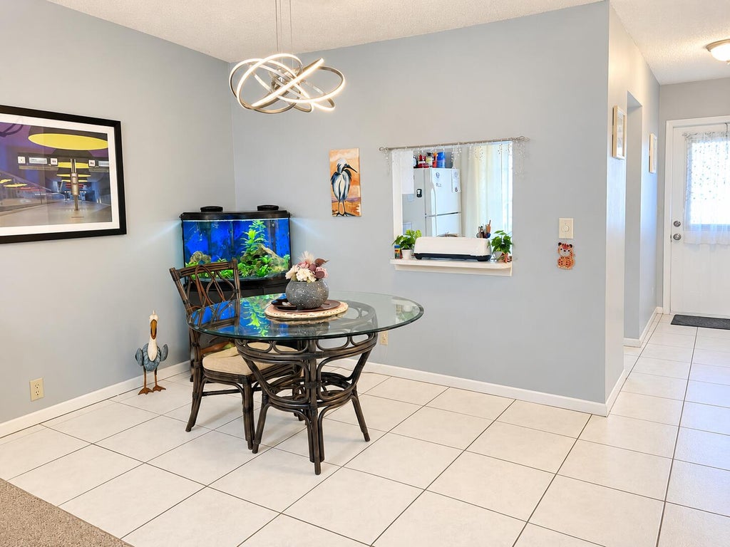 Photo of 550 Covered Bridge BLVD, Lake Worth, FL 33467 (MLS # B26093458)