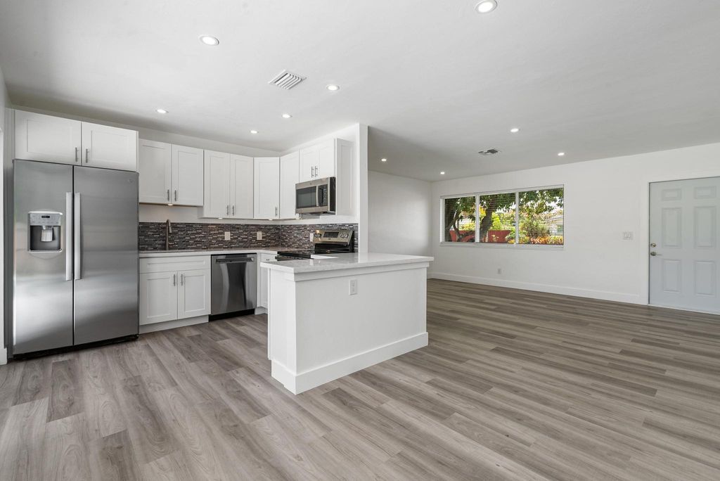 Photo of 311 NW 37th Street, Deerfield Beach, FL 33064 (MLS # R11080464)