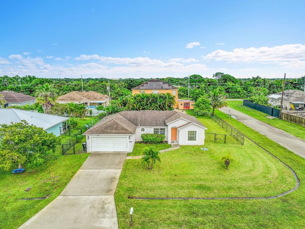 Photo of 3789 SW Haines St, Port Saint Lucie, FL 34953 (MLS # R11129527)