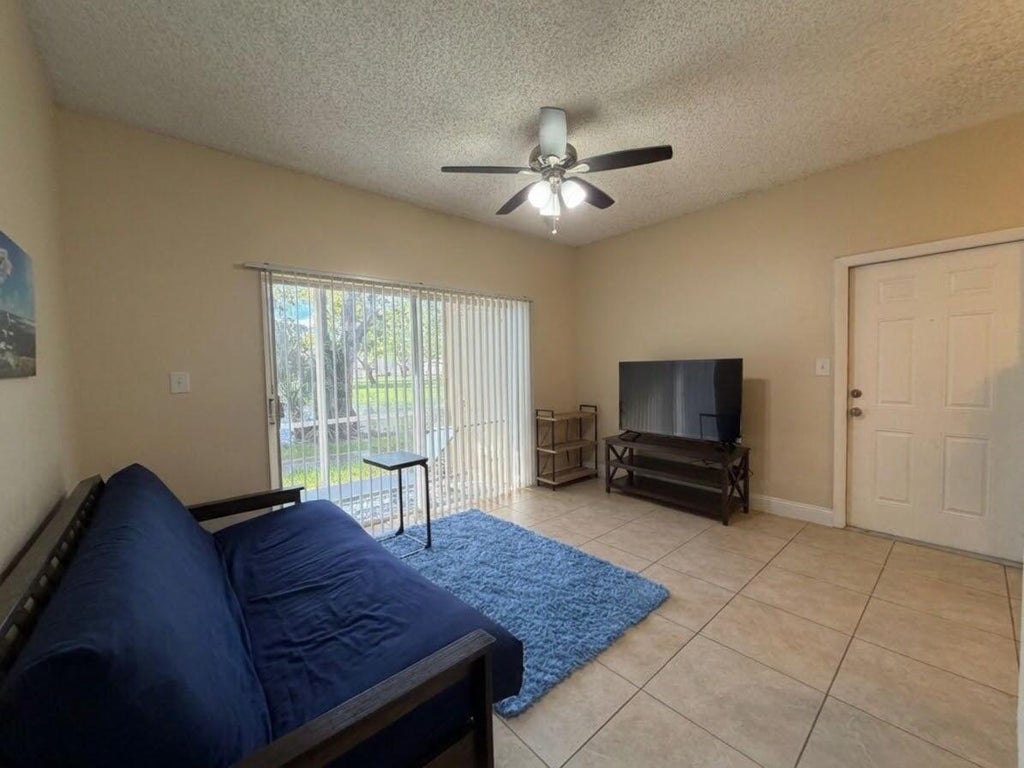 Photo of 661 Cypress Club Way #F, Deerfield Beach, FL 33064 (MLS # B26092968)
