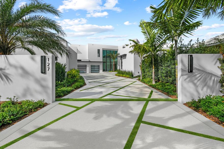 Welcome to a modern masterpiece in the prestigious Admirals Cove community in Jupiter. Nestled on a serene cul-de-sac, this newly constructed waterfront estate spans 13,115 square feet, offering panoramic views of the Intracoastal Waterway and golf course. The expansive lot features a private dock with unobstructed water access. The grand entrance opens to a spacious foyer with imported Italian large format porcelain tile flooring throughout. The first floor showcases a luxurious primary suite with a sitting area, lanai, and his-and-her closets. The gourmet kitchen is a chef's dream, complete with custom cabinetry made of rift cut oak and high gloss pearlized lacquer with solid core box construction, waterfall countertop, integrated dining area, rotating wine feature wall, Sub-Zero Wolf