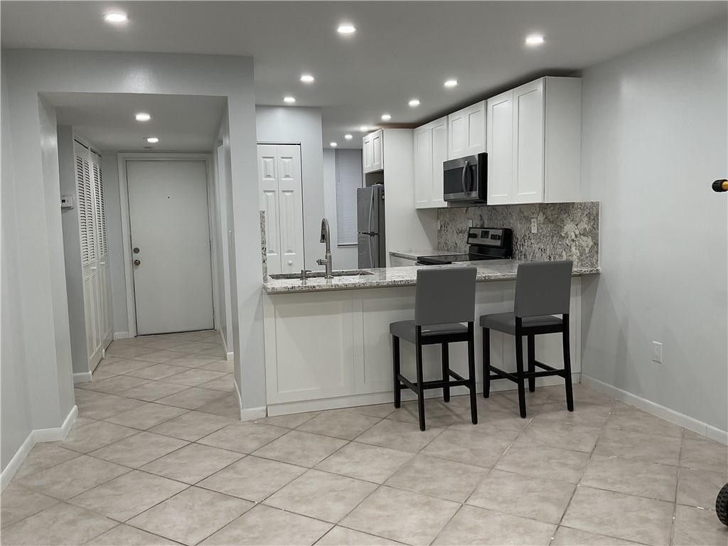 Photo of 6800 Cypress Road #208, Plantation, FL 33317 (MLS # F10505046)