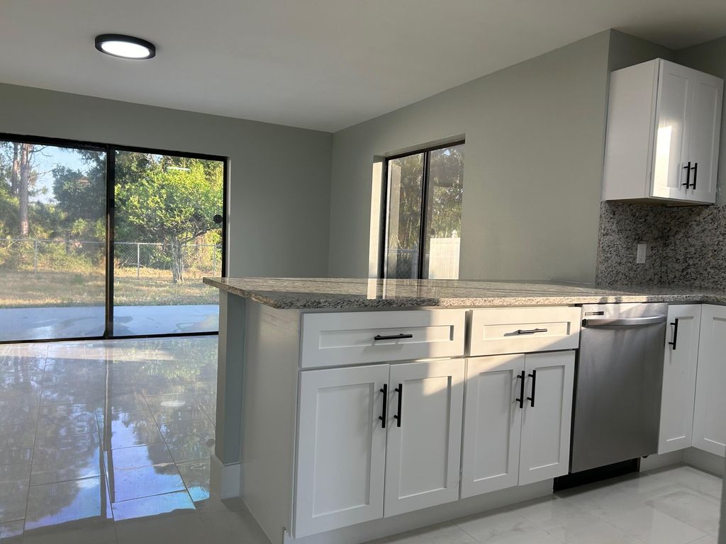 Photo of 1140 SE St Lawrence Way, Stuart, FL 34997 (MLS # R10980337)