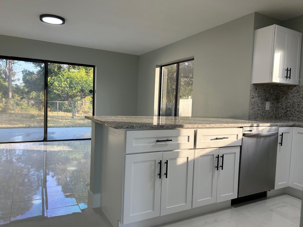 Photo of 1140 SE St Lawrence Way, Stuart, FL 34997 (MLS # R10980337)