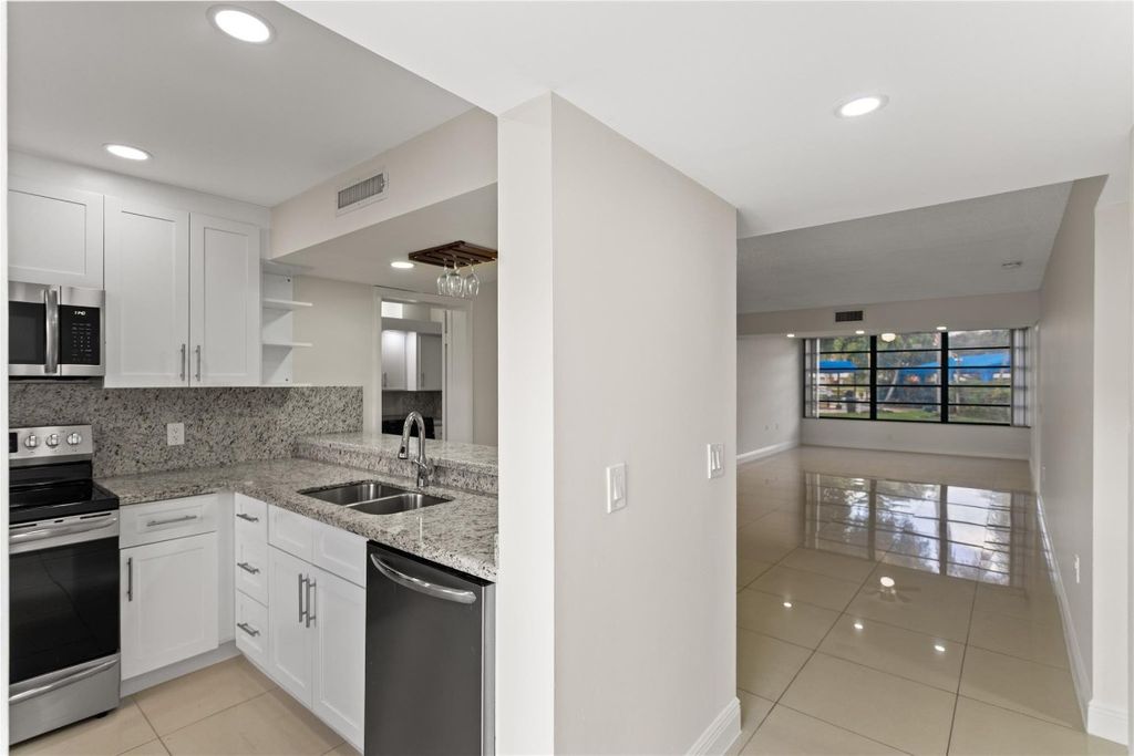 Photo of 1719 Whitehall Drive #104, Davie, FL 33324 (MLS # F10539749)