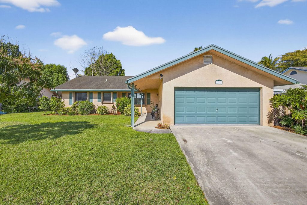 Photo of 132 Parkwood Drive, Royal Palm Beach, FL 33411 (MLS # B26008502)