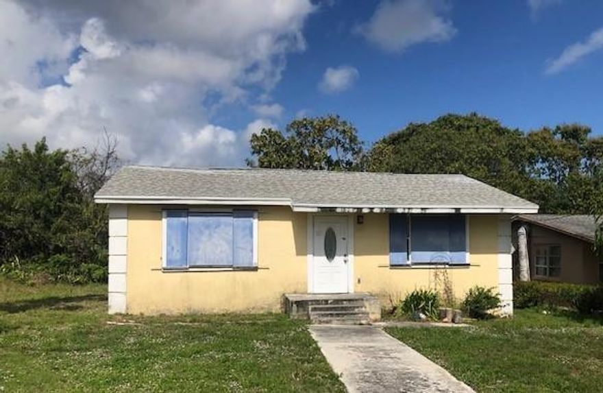 SHORT SALE....Needs TLC.  This cute 2 bedroom; 1 bath home in Hobe Sound can be anything you can make it!!! Great space and possibilities are endless. Outside shed with storage is plumbed for washer and dryer. No HOA, good location, and great yard space makes this a great future home or investment property.  Water heater was relocated to 3rd bedroom and made to storage room.