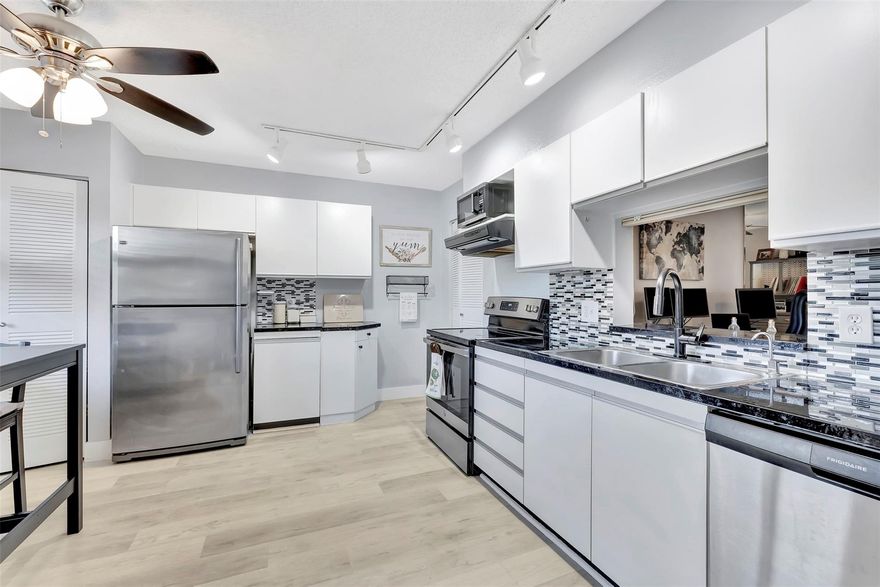 Charming 1BR/2BA sanctuary with modern updates! Enjoy an eat-in kitchen with stainless steel appliances, a convenient walk-in laundry/storage with full size W/D. Unwind in an oversized bedroom with office nook, dual walk-in closets, and a spa-like bath with Roman tub. Entertain in style: living area with wet bar, separate dining, and a spacious balcony overlooking peaceful water views. Recent upgrades include a new water heater and waterproof vinyl flooring. Accordion shutters, low HOA with extensive amenities (clubhouse, sauna, tennis, heated pool, cable, and more), plus a separate storage unit directly next to unit. Guest parking is allowed and marked at RESIDENT on stops. Prime location with quick highway, shopping, and dining access. A vibrant, all-ages community with solid reserves. About the Are: This is exceptional city stands as a flourishing oasis in the heart of Broward County. Coconut Creek prides itself on maintaining a distinctive, close-knit community atmosphere with beautiful parks and numerous recreational activities. Conveniently located for commuters with a short distance to I-95 and turnpike. Minutes to Ft Lauderdale downtown and Intl airport. Close to an array of shopping options, gyms, restaurants, grocery stores, and parks.
