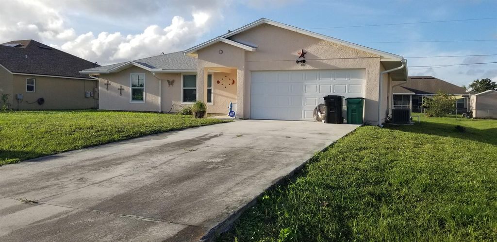 Photo of 481 SW Baoy Avenue, Port Saint Lucie, FL 34953 (MLS # R11035891)