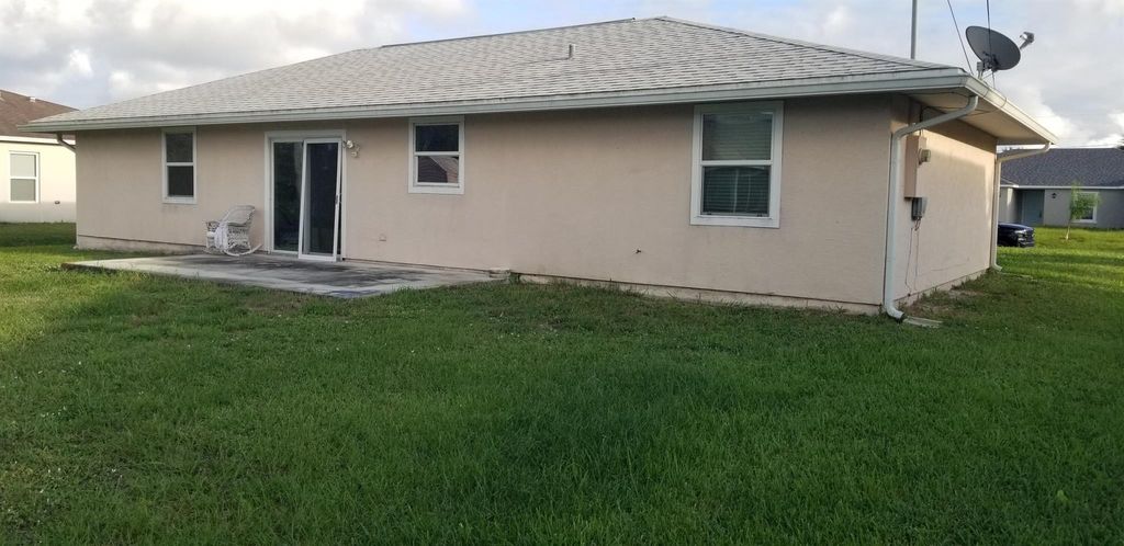Photo of 481 SW Baoy Avenue, Port Saint Lucie, FL 34953 (MLS # R11035891)
