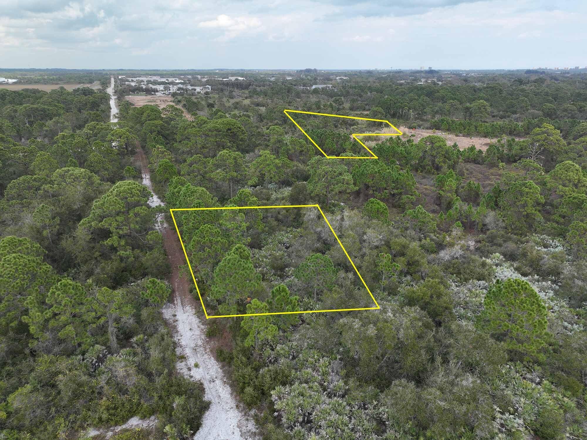Two undeveloped industrial lots strategically located directly south of the Treasure Coast International Airport! Properties are a half-acre square lot and a 1.3-acre triangular lot. No flood zone! Square half acre property to the west can be accessed via dirt road south of intersection of St. Lucie Blvd and Industrial 33rd Street. Triangular 1.3-acre property to the east can be accessed via dirt road off St. Lucie Blvd (gate currently blocks vehicle traffic however.)