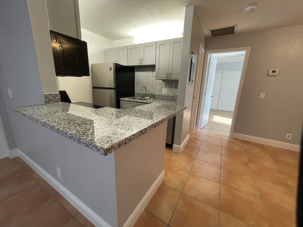 Photo of 5 Crossings Circle #B, Boynton Beach, FL 33435 (MLS # R11047810)