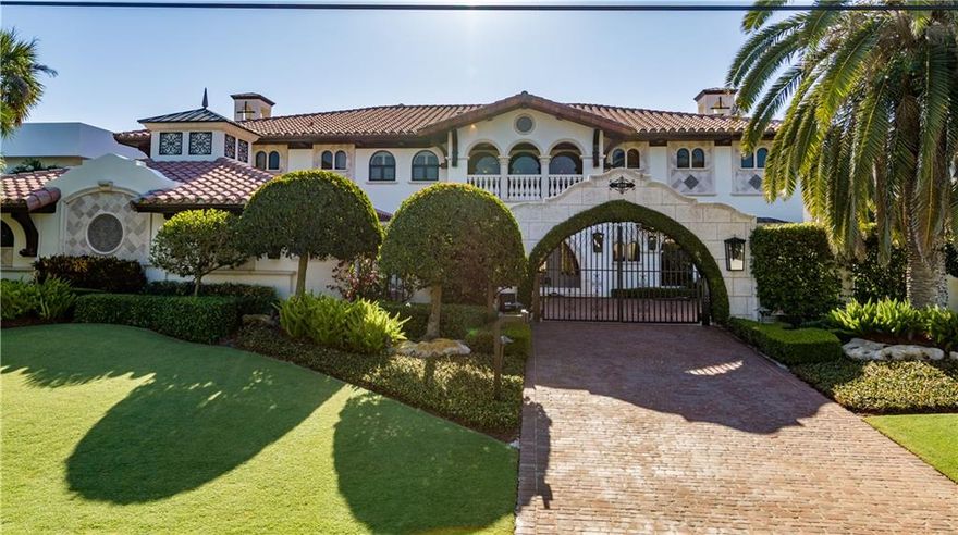 BRAND NEW LOOK!! Freshly painted inside and out, this home looks like it is brand new. You will not believe the transformation! A palatial estate with its magnificent architectural design, elaborate decor and incomparable outdoor entertaining areas, could possibly be the best of the best. From the moment you enter through the security gates and approach the custom double door entry, you feel like you have entered a new world. Every direction you look brings awe to the beholder. With 6 bedrooms + office, 7.5 baths, a separate guesthouse and an extensive list of amenities, this home is truly one of a kind.