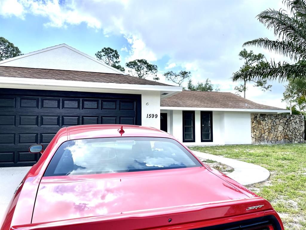 Photo of 1599 SE Crowberry Drive, Port Saint Lucie, FL 34983 (MLS # R10803905)
