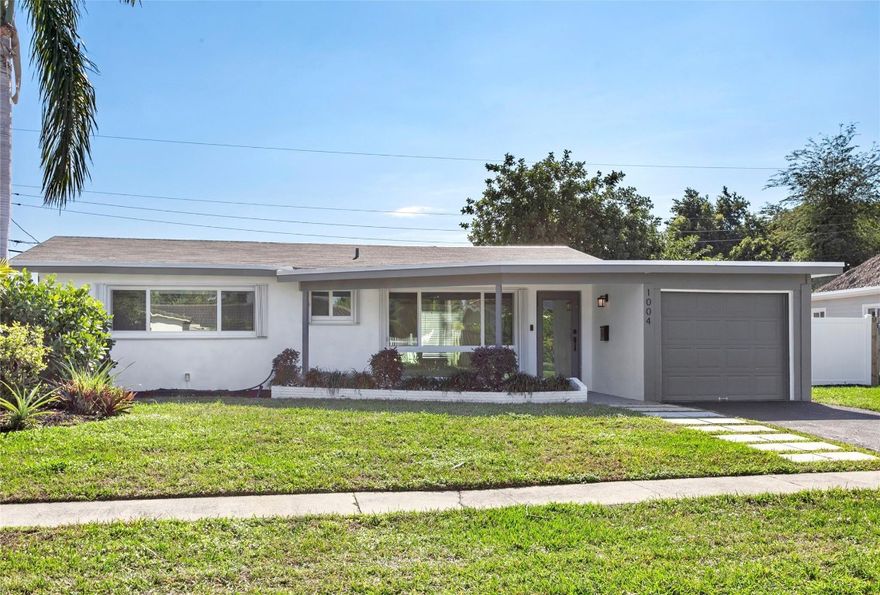 Easy coastal living in this charming and renovated 2 bedroom, 2 bath home in the sought after Cove section of Deerfield Beach, just minutes to the ocean. Ensuite primary, updated kitchen and baths, impact windows, and a newer roof! The functional great room layout with porcelain tile throughout offers a comfortable entertaining space while the one-car garage with air conditioning provides flexibility for parking, storage, or a home gym or workshop. Outside includes a large backyard with a shed and plenty of room to add a pool or create your own outdoor oasis. This gem is ideal as a primary residence, vacation home, or investment property. Close to beaches, dining, shopping, and all that Deerfield Bch has to offer, this home is a wonderful opportunity to enjoy the South Florida lifestyle.