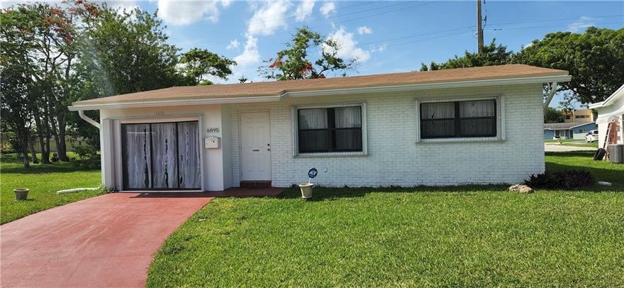 Living is easy in this charming 2/1 single family home with oversized corner lot in Paradise Gardens.  An adult 55+ community with very low HOA fees. They cover lawn service & exterior house paint.   The house features new roof less than 2 years.  Travertine marble flooring throughout and upgraded kitchen with granite counter tops and some stainless steel appliances.  Accordion shutters & large laundry room.  Garage is converted and under air for use as additional family room, study or workshop.  Can be easily converted back to a garage.   Private yard backs up to dead end street for quiet enjoyment.  Community clubhouse & pool are walking distance away and available for private events or daily enjoyment