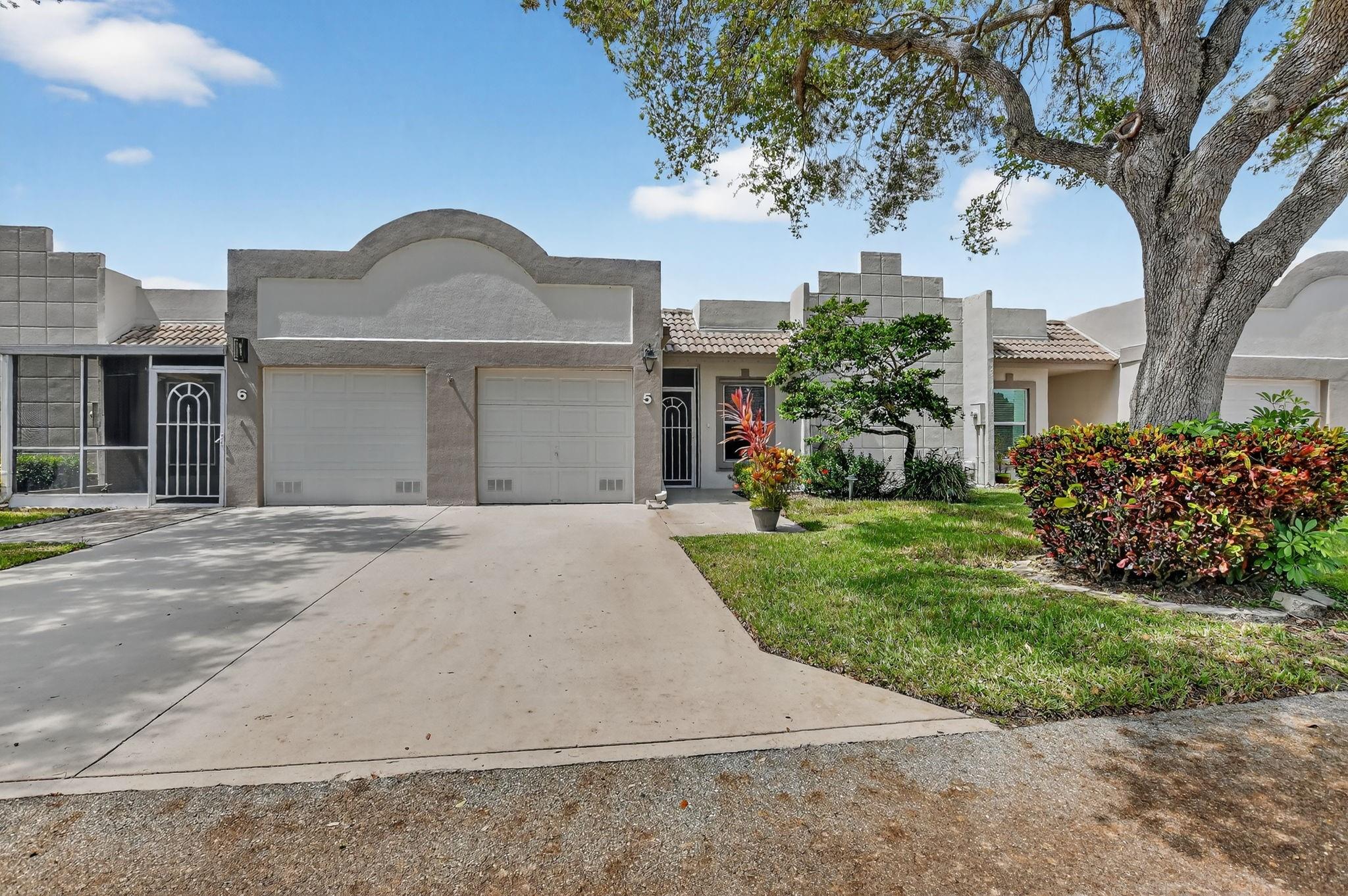 Stunning View from a Spacious Patio   Nestled in a vibrant 55+ community of town villas, this updated home is freshly painted and ready for you to move in. Enjoy a spacious master bedroom with a peaceful lake view, a separate vanity area, and a large shower. The eat-in kitchen and the guest bedroom with its own bath are perfect for hosting visitors. Plus, you’ll have a one-car garage and access to fantastic amenities like tennis, pickleball, a heated pool, a gym, bocce, and more! Become part of a welcoming community that balances relaxation and fun.   A/C under 1 year new…..
Maintenance =  Quarterly $850.00 HOA , Quarterly $288.00 Master Assoc. =( $379.33 per month )
HURRICANE PANELS IN GARAGE.