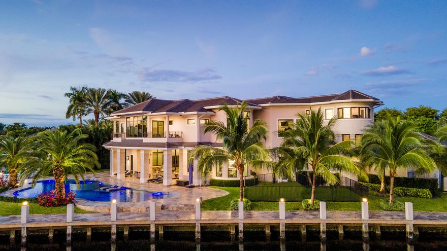 Only 1 mile from Pine Crest School!! Built in 2017 by Shane Ames of Ames International Architecture, this extraordinary custom estate with 250 feet of water frontage sits on an expansive point lot located within the exclusive gated of Bay Colony community in east Fort Lauderdale.  A modern-transitional design with stately architecture and luxurious detailing boasts expansive views from every room and positioned minutes from deep-ocean access!  Features of the smart home include 6 bedrooms all with en-suite bathrooms plus media room, gym, playroom, chef's kitchen w/Wolf - Sub-Zero appliances, large formal dining room - seats 20, indoor/outdoor living and entertainment space, grand resort-style pool, A/C garage storage - up to eight cars (w/ lifts) and a full-home 125kW generator. Only 1 mile from Pine Crest School!! Built in 2017 by Shane Ames of Ames International Architecture, this extraordinary custom estate with 250 feet of water frontage sits on an expansive point lot located within the exclusive gated of Bay Colony community in east Fort Lauderdale.  A modern-transitional design with stately architecture and luxurious detailing boasts expansive views from every room and positioned minutes from deep-ocean access!  Features of the smart home include 6 bedrooms all with en-suite bathrooms plus media room, gym, playroom, chef's kitchen w/Wolf - Sub-Zero appliances, large formal dining room - seats 20, indoor/outdoor living and entertainment space, grand resort-style pool, A/C garage storage - up to eight cars (w/ lifts) and a full-home 125kW generator.  


Specifications:
" 6 bedrooms, media room, gym and playroom
" 6 en-suite bathrooms plus full cabana bath and 2 half bathrooms (powder and in the office)
" 10,414 living sq. ft.
" 13,020 total sq. ft.
" 25,611 lot sq. ft. on point corner lot
" 255' of water frontage
" Finished build in 2017


Features:
" Elevator
" 125kW Quietsource generator, sound attenuated
" Two 1,000-gallon in-ground propane tanks which run five tankless water heaters, generator, pool heater, outdoor barbecue and dryers
" 40,000-gallon pool (78' x 42') with 360-degree champagne spa for 10+
" Eurotech Solarban 66 (Low-E) coastal doors and windows
" Outdoor fenced playground
" 14'+ ceilings throughout
" Climate-controlled attic
" TVSS surge suppression with lightning rod protection system
" Multiple A/C storage closets with MDF/IDFs for home audio/video/telecom
" Distributed smart wi-fi and security system including 28+ IP cameras and network
" Two laundry rooms (one upstairs, one downstairs)
" Full walk-in pantry
" Eight-person theater room with 120" screen
" Ten-zone air conditioning system
" Complete smart home with integrated Control4 and Lutron system throughout
" Five-car garage (holds up to eight cars with lifts)
" Air conditioned garage with insulated garage doors


Residential details:
" All kitchen appliances by Wolf and Sub-Zero
" Double 36" refrigerator/freezer
" Dual kitchen sinks, two dishwashers
" Four ovens (two convection ovens, two convection steam ovens, two warming drawers)
" Breakfast nook
" Marble, onyx, quartz and quartzite countertops
" Multi-service indoor/outdoor wet bar
" Twenty-person dining room with its own butler pantry with additional refrigeration
" VIP guestroom on the ground floor
" Toto G Series washlets in the master, VIP and powder bath
" Quartz flooring on staircases
" Italian porcelain flooring (71" x 32")
" His & Hers (two-story) closets in master bedroom
" His & Hers toilets in master bathroom
" Master shower has steam shower as well as spa bathtub
" Separate massage room off master bathroom
" Double balcony off master bedroom
" Each guestroom upstairs has its own balcony
" Maid/au-pair quarters in between the first and second floors with separate back staircase access

DISCLAIMER: Information published or otherwise provided by the listing company and its representatives including but not limited to prices, measurements, square footages, lot sizes, calculations and statistics are deemed reliable but are not guaranteed and are subject to errors, omissions or changes without notice. All such information should be independently verified by any prospective purchaser or seller. Parties should perform their own due diligence to verify such information prior to a sale or listing. Listing company expressly disclaims any warranty or representation regarding such information. Prices published are either list price, sold price, and/or last asking price. The listing company participates in the Multiple Listing Service and IDX. The properties published as listed and sold are not necessarily exclusive to listing company and may be listed or have sold with other members of the Multiple Listing Service. Transactions where listing company represented both buyers and sellers are calculated as two sales. If your property is currently listed with another broker, please disregard any solicitation for services.