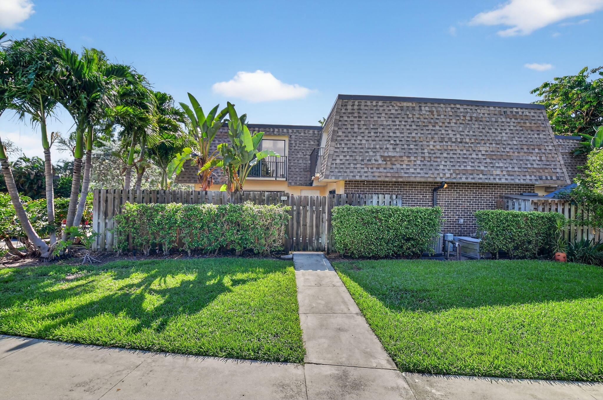 Don't miss this spacious 2BR/2.5BA townhome in a tranquil, secluded community with easy access to I-95. Freshly painted with neutral tile floors throughout, new kitchen appliances, new modern ceiling fans in living room & primary bedroom and a 2022 water heater. The open layout offers expanded living and dining space, while a beautifully tiled private patio extends your living area outdoors. Located in an all-age, investor-friendly community with immediate rentals allowed. Residents enjoy a heated saltwater community pool, tennis & pickleball courts, fitness room, clubhouse, and more. Prime South Florida location--just minutes to beaches, shopping, and dining. Don't miss this opportunity!