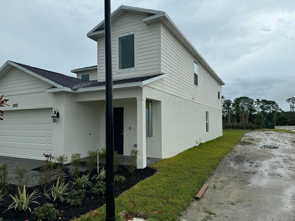 Photo of 5933 NW Sweetwood Drive, Port Saint Lucie, FL 34987 (MLS # R11167633)