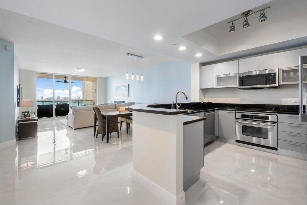 Photo of 2650 Lake Shore Drive #1003, Riviera Beach, FL 33404 (MLS # B26021399)