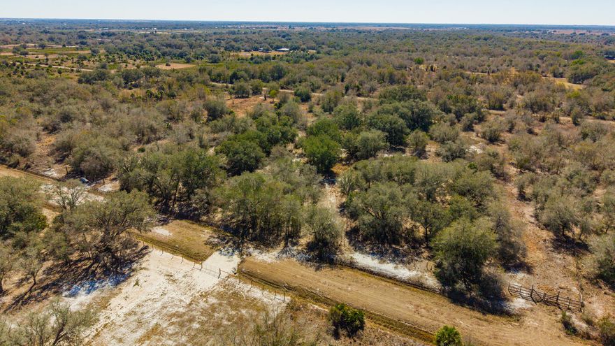 Bring your dreams to life on this high and dry, buildable vacant lot offering privacy, and a great foundation to get started. This property is completely fenced & gated and features a 120-ft simple well pump that can be used by hand or connected to electricity or solar. A solid driveway with culvert pipe is already in place, and a raised pad of compacted dirt has previously accommodated two 12x32 sheds, providing a great base for storage, workshops, or future structures. Toward the back of the property, you'll find a small pond, adding charm & potential water source for livestock, gardening, or simply relaxation. Whether you're dreaming of a small farm, garden oasis, or a peaceful country retreat, this property offers the space and flexibility to create your ideal homestead!